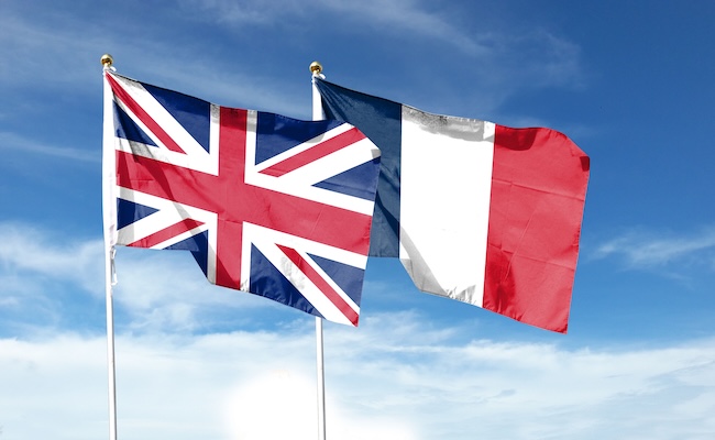 unionjackandfrenchflagoncloudysky-wavingin